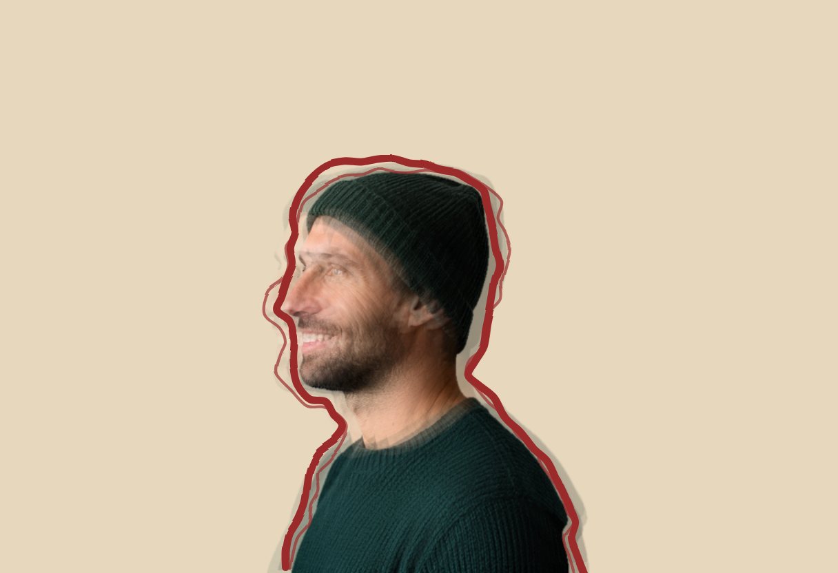 A smiling man in a beanie seen from the side, overlaid with shifted, faded copies of himself and outlined by a hand-drawn red line
